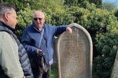 Rand Smith on the left and Malcolm Atkins on the right next to the headstone of William Atkins , Catherine Smith , Benjamin Anthony Atkins  and Aubrey Atkins, Benjamins brother.Cousins from either side of the world met by chance after miraculously turning up to their ancestors grave - at the same time. Ian Brandon and Malcolm Atkins were visiting the grave of their third great-grandfather Anthony Smith only to find a couple from the US doing the same.Rand and Janeel Smith made the 3,700-mile journey from Kansas City to Raunds, Northants., to see where his family originated. But the couple were left gobsmacked when Ian and Malcolm arrived on September 22 and realised they were actually related.   Photo released 30/09/2025