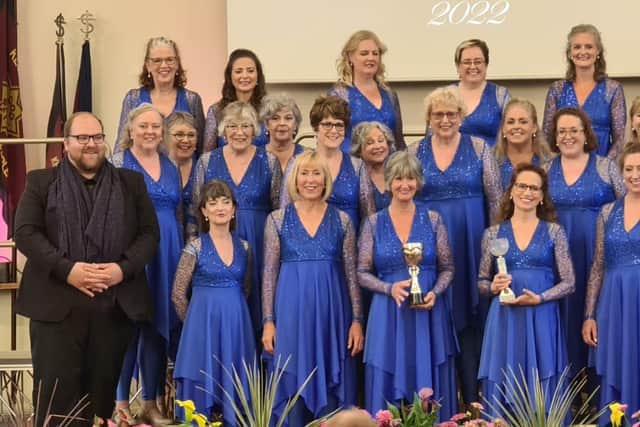 Josh Daniel with one of the winning choirs