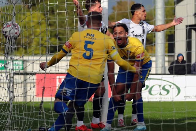 Jack O'Connor (no 5) celebrates scoring Wellingborough's second goal against Corby Town on Saturday (Picture: Rob Webb)