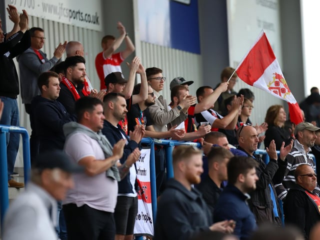 The large contingent of Poppies fans applaud their team despite the disappointment