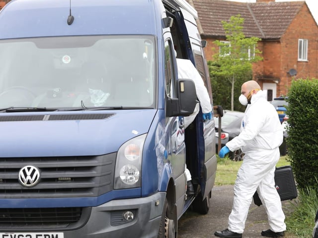 Officers are searching a property in Corby