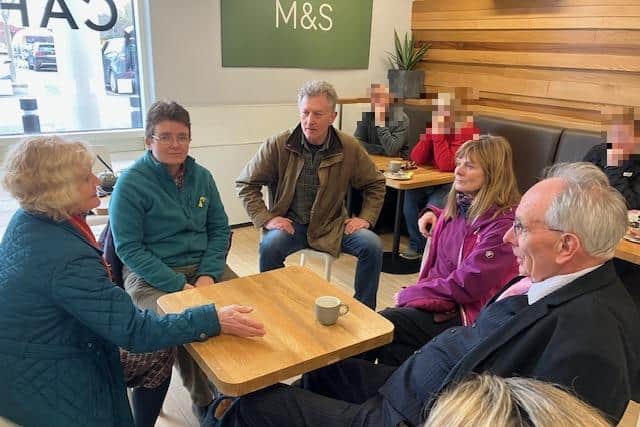 NNC Cllr Val Anslow (Lab, Croyland and Swanspool) and Wellingborough Town councillor Marion Turner-Hawes and residents talk to Peter Bone MP in M&S cafe after the protest dispersed