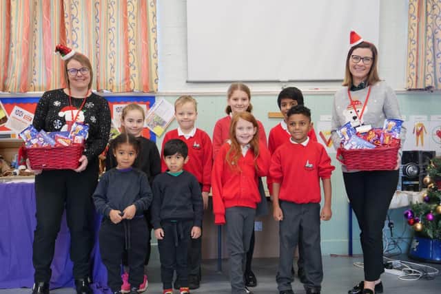 Pictured from left to right: Stacey Groom and Estelle Douglas from Matthew Oliver Windows & Doors with pupils at Wilby CE Primary School.