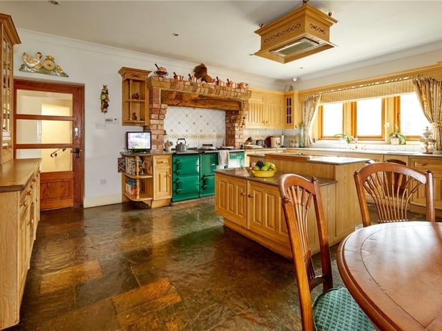 The home has traditional features as well as an indoor swimming pool, equestrian facilities and extensive parkland.