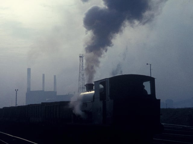 A Minerals Division Kitson 0-6-0ST propels a rake of loaded iron ore wagons into the steelworks at Corby. (Photo by Rail Photo/Construction Photography/Avalon/Getty Images)