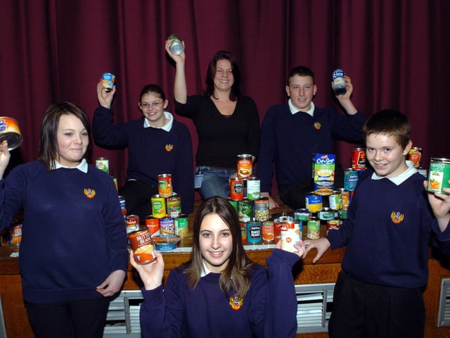 November 2007, donations for Accommodation Concern. Back, from left, Lauren Ward, 13, housing advisor Louise Hodgkinson, and Matthew Collins, 13. Front, from left, Molly Whitfield, 13, Lyndsey Emberson, 14, and Sam Mulligan, 13