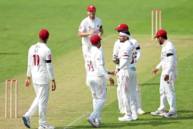 Siddharth Kaul celebrates with his Northants team-mates after claiming one of his four wickets against Gloucestershire (Picture: Peter Short)