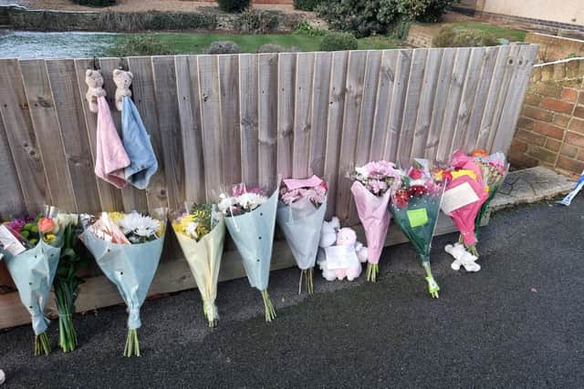 Flowers and cuddly toys left at the scene