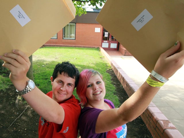Adam Parrish and Heather Smith with their exam results, 2010