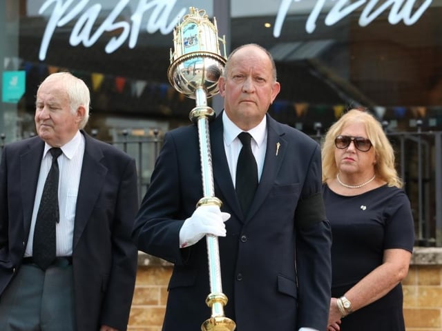 Martin Lewis carries the mace that represent the monarch's authority