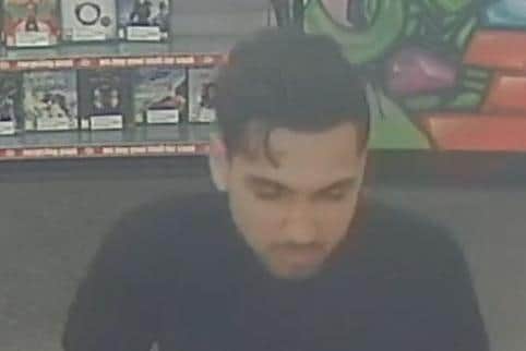 CCTV image from Corby CEX of a man Northants Police would like to identify