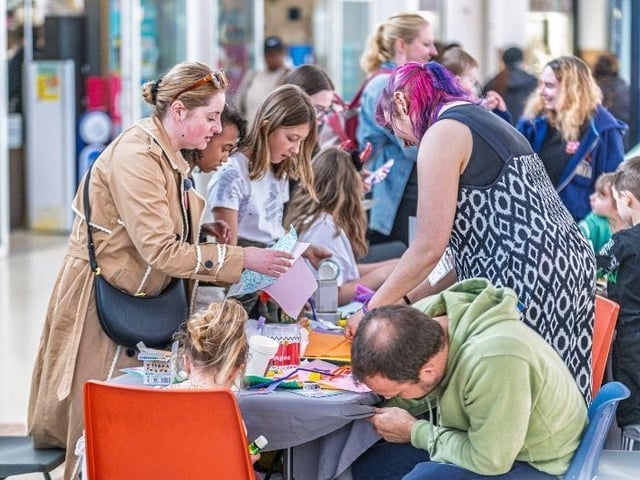 MP Gen Kitchen at a craft table at Well Creative Festival