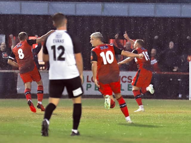 Sam Bennett heads off to celebrate after he opened the scoring with his first goal for the club in Kettering Town's 2-0 victory over AFC Telford United. Picture by Peter Short