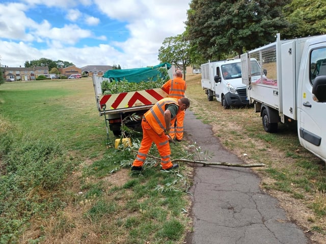 Members of NNC's street cleaning team helped cut back hedges and remove overhanging branches