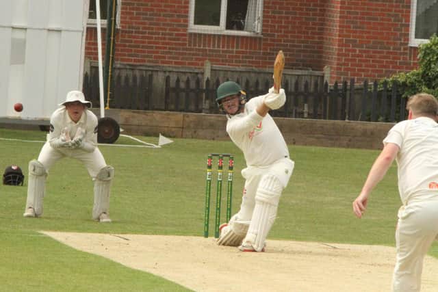 Saints hit out during their NCL Division Two win over Brigstock (Picture: Finbarr Carroll)