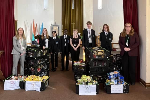 Staff and students went to St Columba's Church to hand over the donation to the Corby Foodbank. Image: DRET