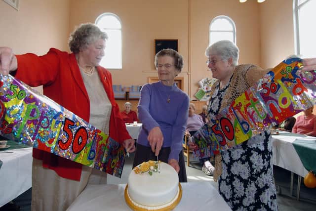 Gloria Wallis (right) helping with the celebrations for the Over 60s 50th birthday in April 2006