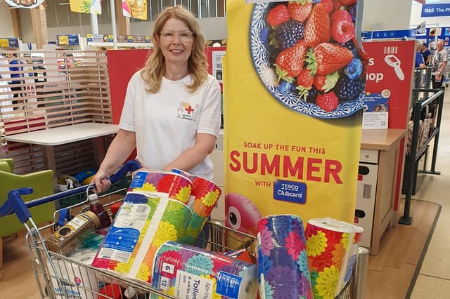 Pictured is Tracy Shepherd, human resources manager at PDI International, with the £200 of goods bought and donated to Corby Foodbank