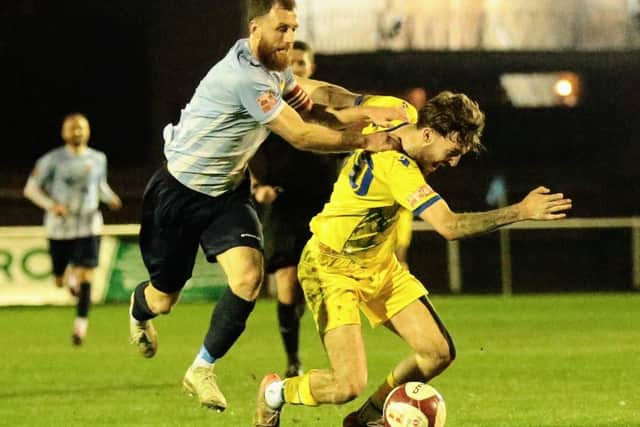 Will Jones is hauled to the ground during Wellingborough Town's 4-1 win at Coventry Sphinx on Tuesday night (Picture: Rob Webb)