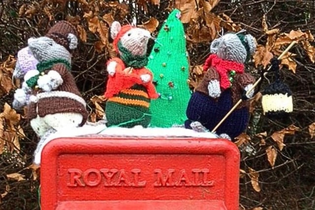 Rushden Yarn Bombers have decorated the town's post boxes with festive toppers