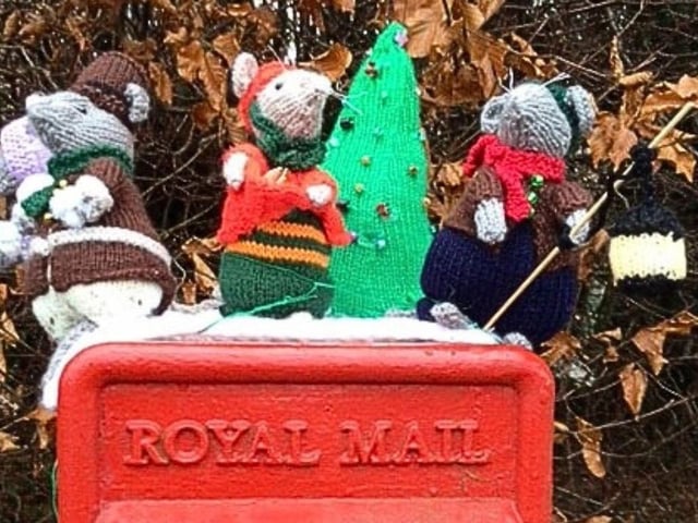 Rushden Yarn Bombers have decorated the town's post boxes with festive toppers