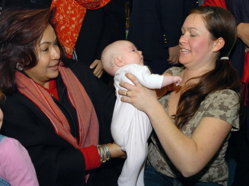 A Malayan delegation visit Pen Green in 2006 with Datin Sri Rosmah Mansor, seven week old Millie Crawford and mum Michelle.
