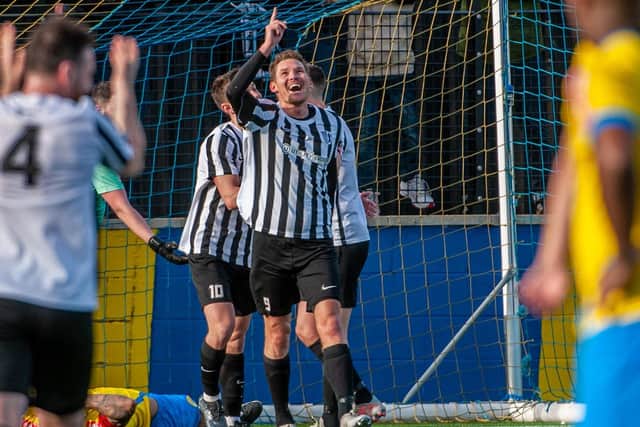 Elliot Sandy rescued a point with a late header for 10-man Corby Town