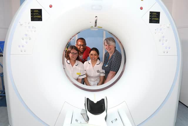 Radiography team - Gina Waddington, Nelson Ali, Hajar Zanjani-Hassanlouei and Caz Dyer with one of the CT scanners at Kettering General Hospital