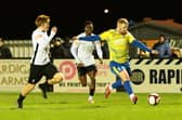 Sam Warburton gets a cross in for Wellingborough Town against Corby Town on Wednesday (Picture: Rob Webb)