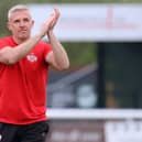 Richard Lavery applauds the travelling supporters after Kettering's 1-0 win at Biggleswade on Easter Monday