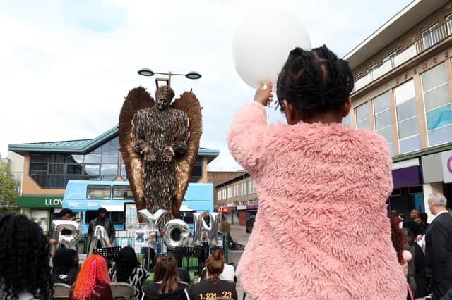 People gathered at the Knife Angel in Corby town centre to mark the first anniversary of the death of teenager Rayon Pennycook