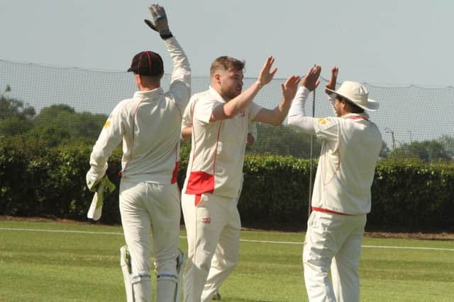 Brigstock celebrate a wicket during their 119-run win against Overstone Park in the NCL Premier Division. Pictures by Finbarr Carroll