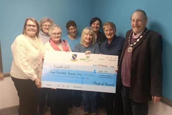 Raunds WI was presented a cheque for £300 from the town council
