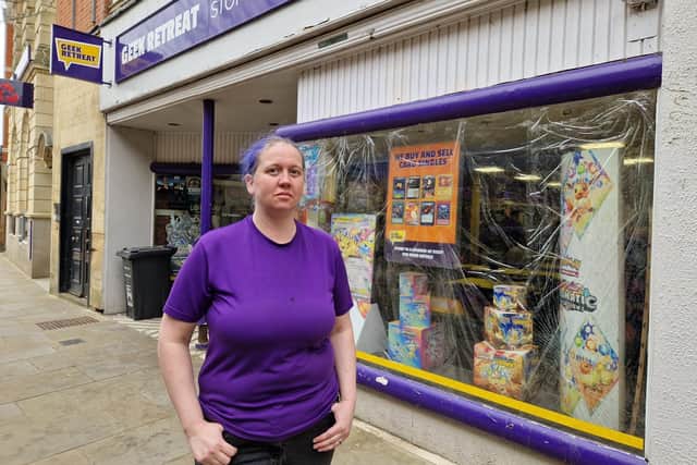 Manager of Geek Retreat Loz Bone outside the store/National World
