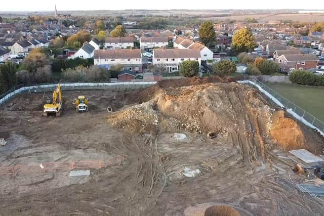 The pile of 'over burden' has been stored in a hug pile on the boundary of the site in Irchester