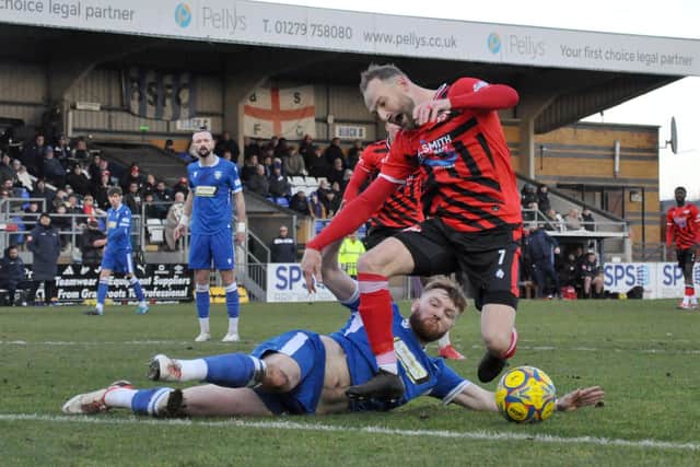 Charlie Johnson brings down Wes York for the Poppies' penalty (Picture: Peter Short)