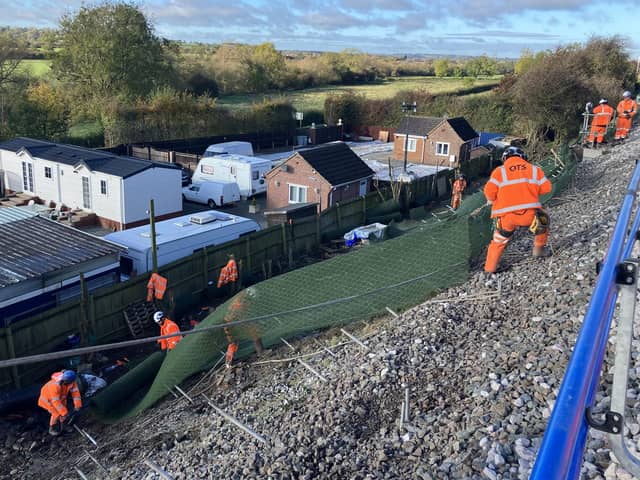 Network Rail maintenance crews work on the embankment near Braybrooke
