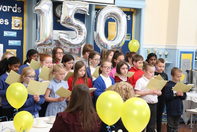 The Alfred Street Junior School choir sing for the guests