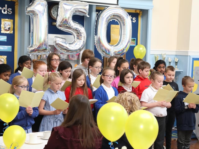 The Alfred Street Junior School choir sing for the guests