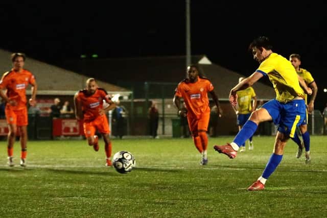 Ethan Johnston slots home from the penalty spot (Picture: Rob Webb)
