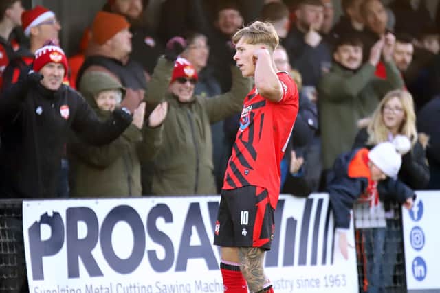 Eddie Panter celebrates a goal with the Poppies supporters (Picture: Peter Short)