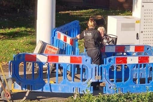 Catherine Thompson talking with the police
