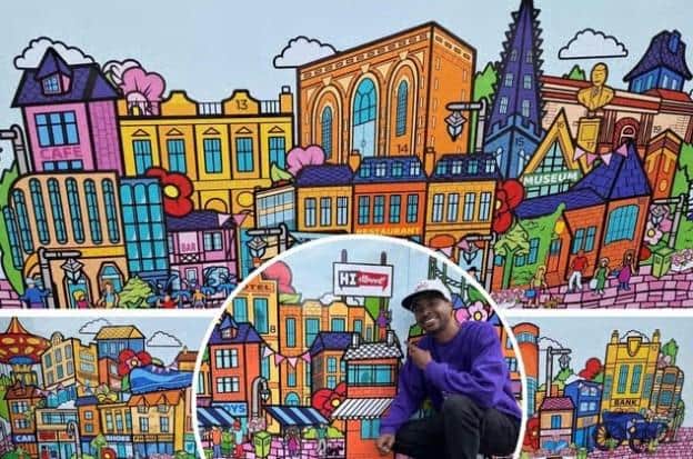 Kettering Market Place - artist Marvin Mudzongo with the artwork he illustrated and digitally designed of Kettering which highlights landmarks across the town /NNC/National World