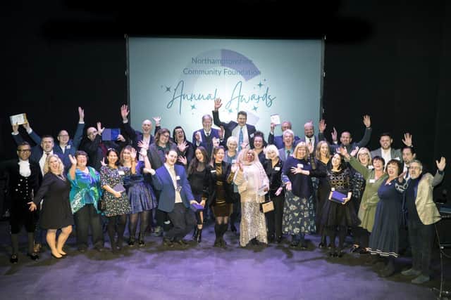 Annual Awards winners &amp; judges celebrating on stage 