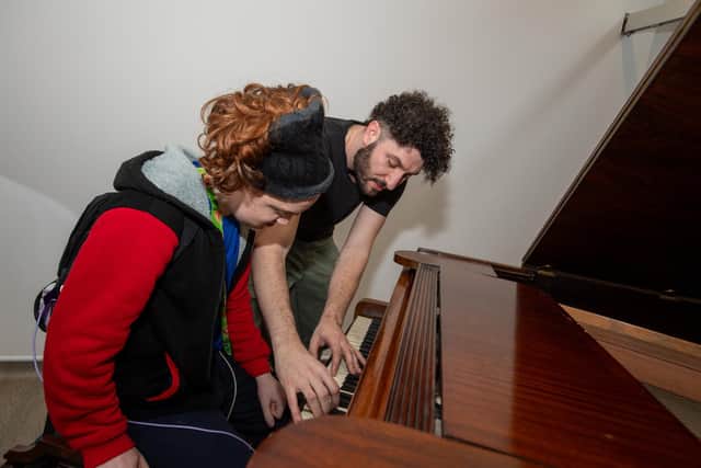 Billy Lockett visiting Greenfields Specialist School For Communication to donate the piano he wrote his debut album on. Photo by David Jackson.