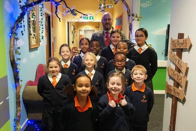 Pupils with headteacher RIchard Albert/Hayfield Cross CofE School