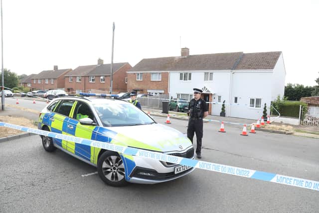 Police officers at the cordon on the junction of Hillcrest Avenue and Queensway in Burton Latimer/IMG