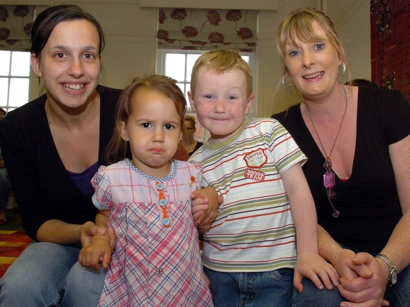 Parents collect their new certificates in understanding child learning in 2008. Pictured are Tina Kemp with not-so-keen daughter Alix Kemp, Michael Carroll, 4, and Mum Fiona Easton.