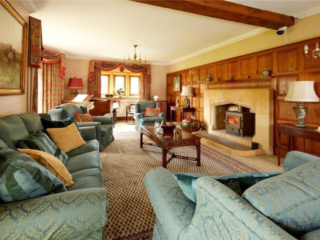 The home has traditional features as well as an indoor swimming pool, equestrian facilities and extensive parkland.