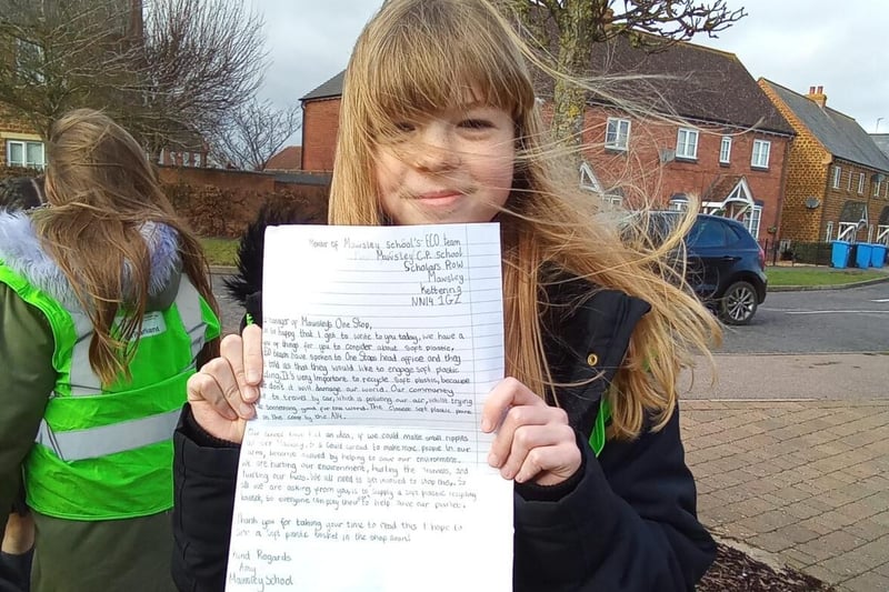 Amy with her letter to the Manager of Mawsley's One Stop